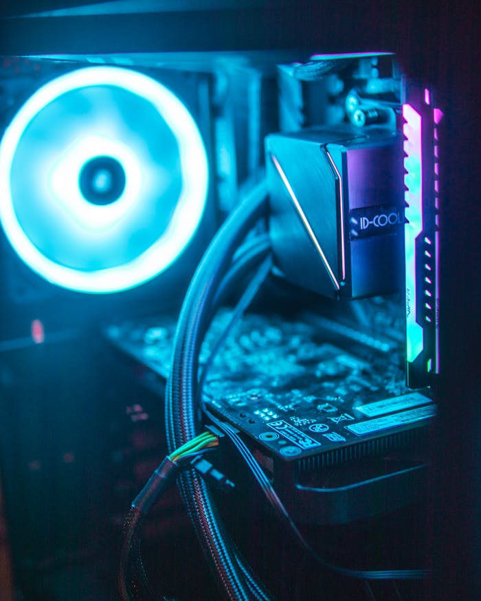 Vibrant RGB lighting on modern computer hardware components inside a desktop.